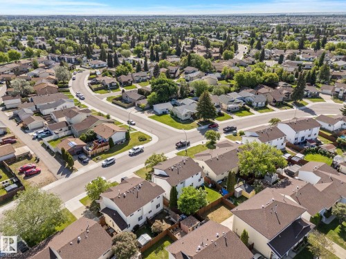 Residential neighborhood featuring extensive mature trees and curved street layouts - 17132 103 Street Nw, Edmonton, AB 