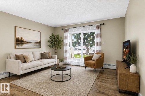 Wood-finish flooring, light-toned wall paint, and a sliding glass door - #102 6710 158 Av Nw, Edmonton, AB 