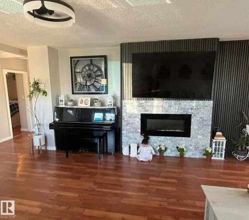 5027 49 Ave, Vilna, AB - Indoor Photo Showing Living Room With Fireplace
