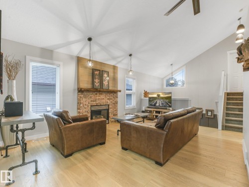 4409 58 Street, Beaumont, AB - Indoor Photo Showing Living Room With Fireplace