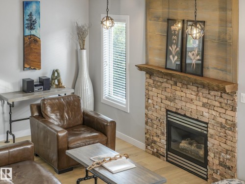 4409 58 Street, Beaumont, AB - Indoor Photo Showing Living Room With Fireplace
