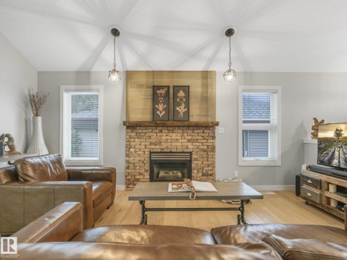 4409 58 Street, Beaumont, AB - Indoor Photo Showing Living Room With Fireplace