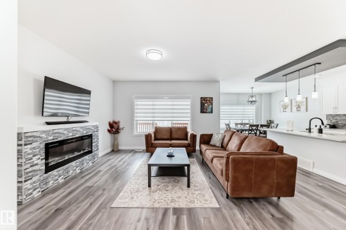 7035 Chivers Loop Sw, Edmonton, AB - Indoor Photo Showing Living Room With Fireplace