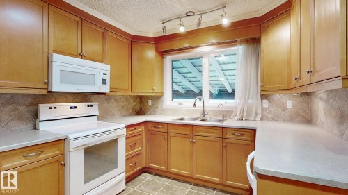 11031 152 Street Nw, Edmonton, AB - Indoor Photo Showing Kitchen With Double Sink