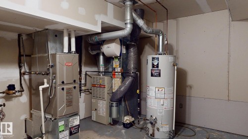2 furnaces, one for each floor. - 11031 152 Street Nw, Edmonton, AB - Indoor Photo Showing Basement