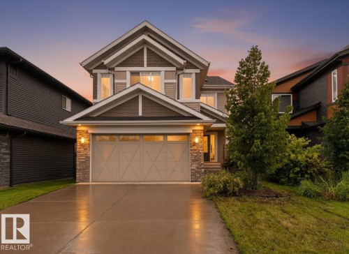 Craftsman-style exterior with stone and siding accents - 7014 Chivers Loop Sw, Edmonton, AB 