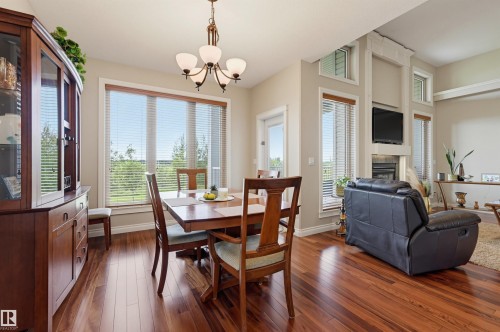 49 Danfield Place, Spruce Grove, AB - Indoor Photo Showing Dining Room With Fireplace