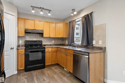 7847 7 Avenue Sw, Edmonton, AB - Indoor Photo Showing Kitchen With Double Sink