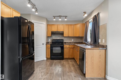 7847 7 Avenue Sw, Edmonton, AB - Indoor Photo Showing Kitchen With Double Sink