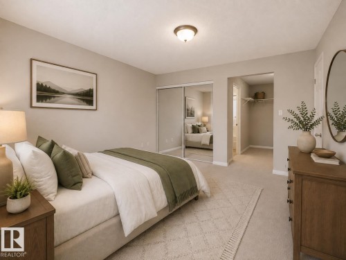 Neutral wall color, wall-to-wall carpeting, ceiling-mounted light fixture, mirrored closet doors, and an open closet with shelving - #1418 330 Clareview Station Dr Nw, Edmonton, AB - Indoor Photo Showing Bedroom