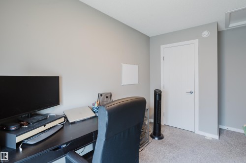 Wall-to-wall carpeting with a neutral color palette - #28 2215 24 St Nw, Edmonton, AB - Indoor Photo Showing Office
