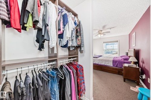 Custom closet shelving system with hanging rods - #108 12028 103 Av Nw, Edmonton, AB 