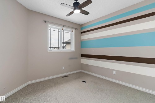 Textured carpet flooring - 20845 92A Avenue Nw, Edmonton, AB - Indoor Photo Showing Other Room