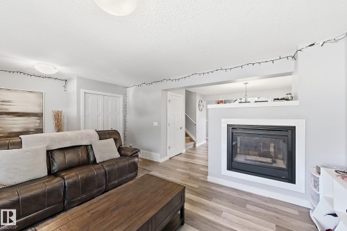 187 Radcliffe Wynd, Fort Saskatchewan, AB - Indoor Photo Showing Living Room With Fireplace