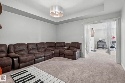 Recessed ceiling detail with a central pendant light fixture - 923 174St Sw, Edmonton, AB 