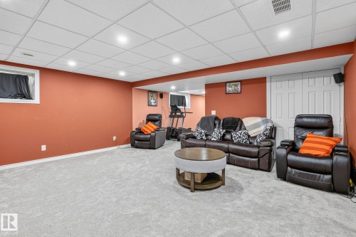 Recessed lighting, drop ceiling, wall-to-wall carpeting, and a white paneled door - 923 174St Sw, Edmonton, AB 