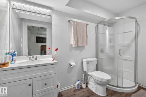 Vanity with integrated sink, chrome faucet, and storage cabinetry - 923 174St Sw, Edmonton, AB 