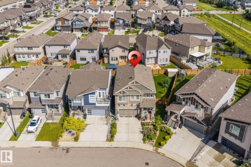 Two-story residential structure with a front-facing garage, concrete driveway, and front landscaping - 923 174St Sw, Edmonton, AB 