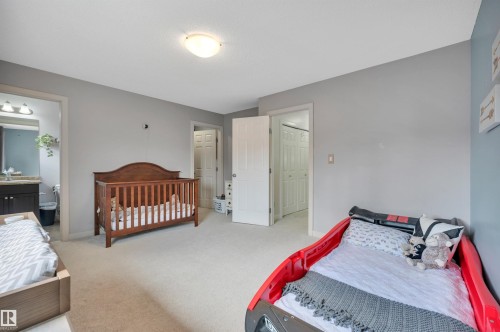 Plush carpeted flooring, neutral wall tones, and recessed ceiling lighting - 17321 8A Avenue Sw, Edmonton, AB - Indoor Photo Showing Bedroom