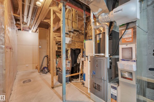 HVAC system, water heater, and exposed wood framing - 17321 8A Avenue Sw, Edmonton, AB - Indoor Photo Showing Basement