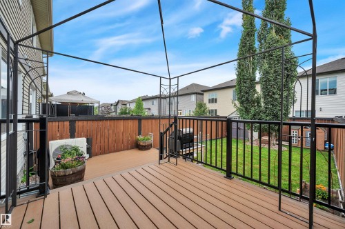 Expansive composite deck featuring a metal gazebo frame and black metal railings - 17321 8A Avenue Sw, Edmonton, AB - Outdoor With Deck Patio Veranda With Exterior