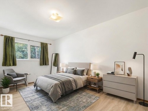 Recessed window with white trim, wood-finish flooring, and a flat white ceiling - 16428 88 Avenue Nw, Edmonton, AB - Indoor Photo Showing Bedroom