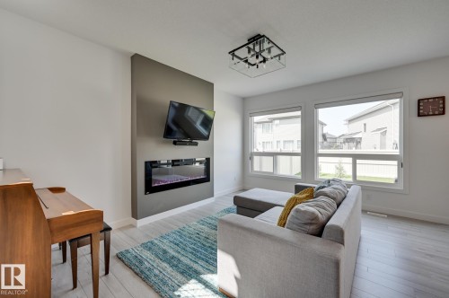 15628 15 Avenue Sw, Edmonton, AB - Indoor Photo Showing Living Room With Fireplace