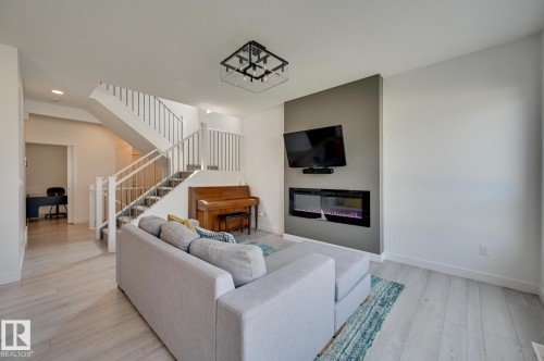 15628 15 Avenue Sw, Edmonton, AB - Indoor Photo Showing Living Room With Fireplace