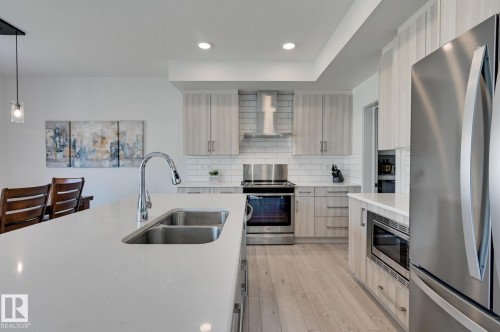 15628 15 Avenue Sw, Edmonton, AB - Indoor Photo Showing Kitchen With Double Sink With Upgraded Kitchen