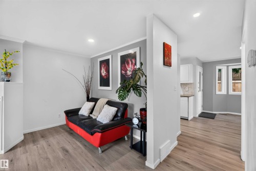 Light gray painted walls and wood-finish flooring - #28 3645 145 Av Nw, Edmonton, AB - Indoor