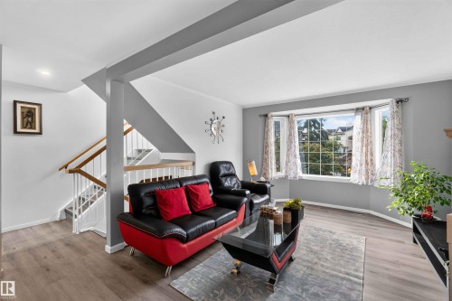 Wood-finish flooring throughout the room - #28 3645 145 Av Nw, Edmonton, AB - Indoor