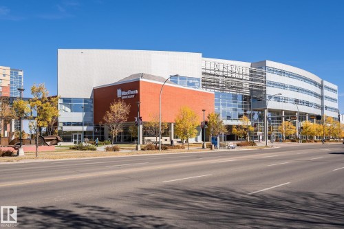 Multi-story commercial building featuring extensive glazing, brick facade, and a modern architectural design - #219 10333 112 St Nw, Edmonton, AB - Outdoor