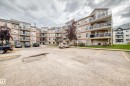 Multi-story building featuring private balconies with glass railings - #331 9704 174 St Nw, Edmonton, AB  - Outdoor With Facade 