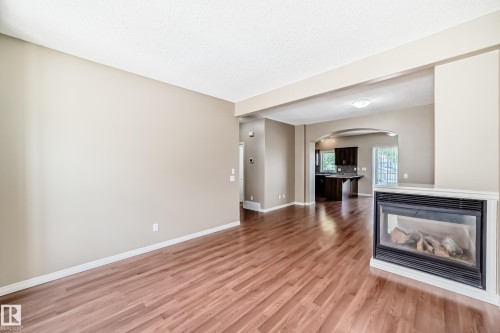 #4 5102 30 Av, Beaumont, AB - Indoor Photo Showing Other Room With Fireplace