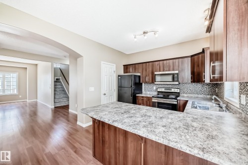 #4 5102 30 Av, Beaumont, AB - Indoor Photo Showing Kitchen With Double Sink With Upgraded Kitchen