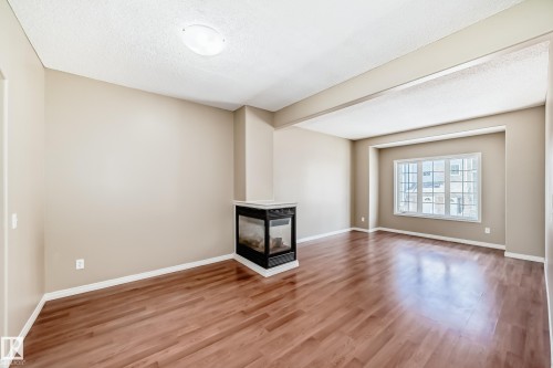 #4 5102 30 Av, Beaumont, AB - Indoor With Fireplace