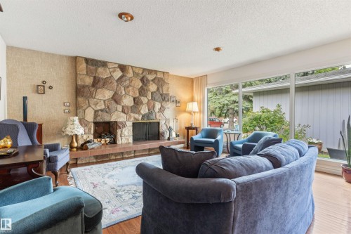 7 Quesnell Crescent Nw, Edmonton, AB - Indoor Photo Showing Living Room With Fireplace