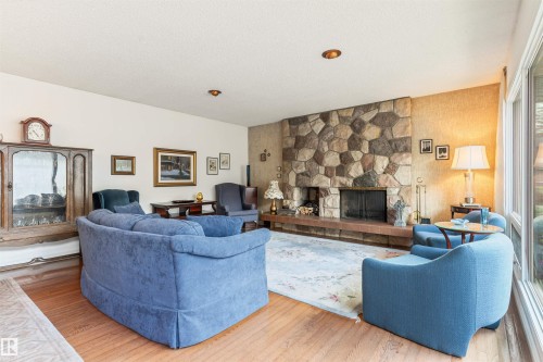 7 Quesnell Crescent Nw, Edmonton, AB - Indoor Photo Showing Living Room With Fireplace