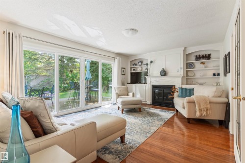 7 Quesnell Crescent Nw, Edmonton, AB - Indoor Photo Showing Living Room With Fireplace