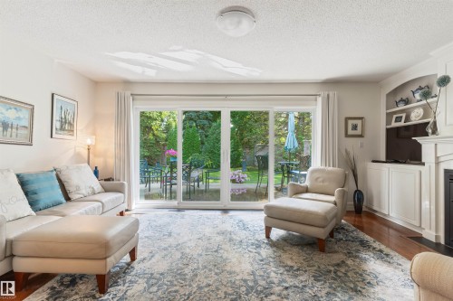 7 Quesnell Crescent Nw, Edmonton, AB - Indoor Photo Showing Living Room With Fireplace
