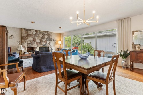 7 Quesnell Crescent Nw, Edmonton, AB - Indoor Photo Showing Dining Room With Fireplace