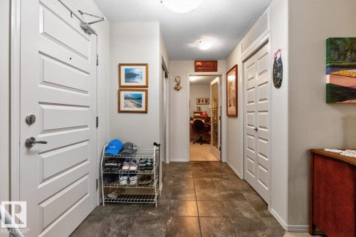 Tiled flooring with a neutral finish - #210 7909 71 St Nw, Edmonton, AB - Indoor Photo Showing Other Room