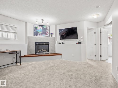 2916 31 Street Nw, Edmonton, AB - Indoor Photo Showing Living Room With Fireplace