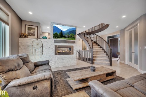 4510 Wingfield Bay Nw, Edmonton, AB - Indoor Photo Showing Living Room With Fireplace