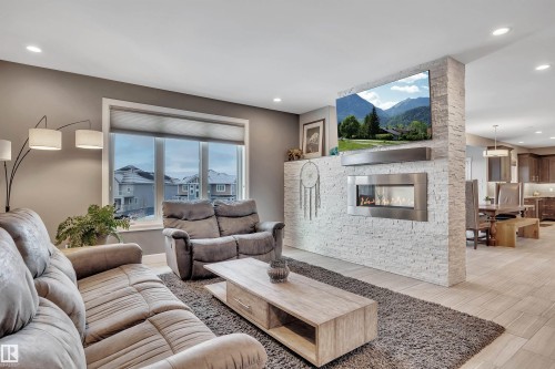 4510 Wingfield Bay Nw, Edmonton, AB - Indoor Photo Showing Living Room With Fireplace
