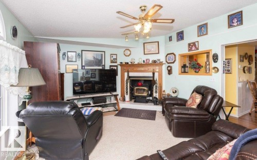 4903A 47 Avenue, Rural Westlock County, AB - Indoor Photo Showing Living Room With Fireplace