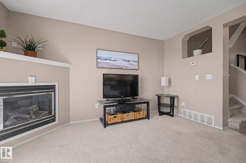 9083 Scott Crescent Nw, Edmonton, AB - Indoor Photo Showing Living Room With Fireplace