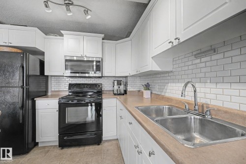 9083 Scott Crescent Nw, Edmonton, AB - Indoor Photo Showing Kitchen With Double Sink