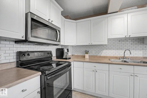 9083 Scott Crescent Nw, Edmonton, AB - Indoor Photo Showing Kitchen With Double Sink