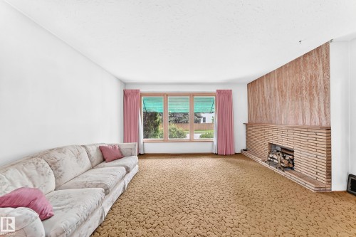 12720 120 Avenue Nw, Edmonton, AB - Indoor Photo Showing Living Room With Fireplace